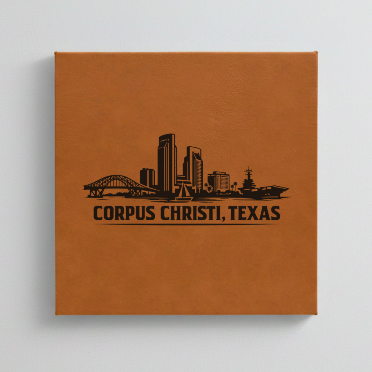 Close up of the Corpus Christi, Texas skyline engraved on Brown leatherette