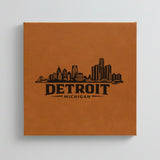 Close up of the Detroit, Michigan skyline engraved on Brown leatherette