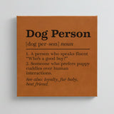 Close-up of the brown leatherette wall sign engraved with the Dog Person dictionary definition