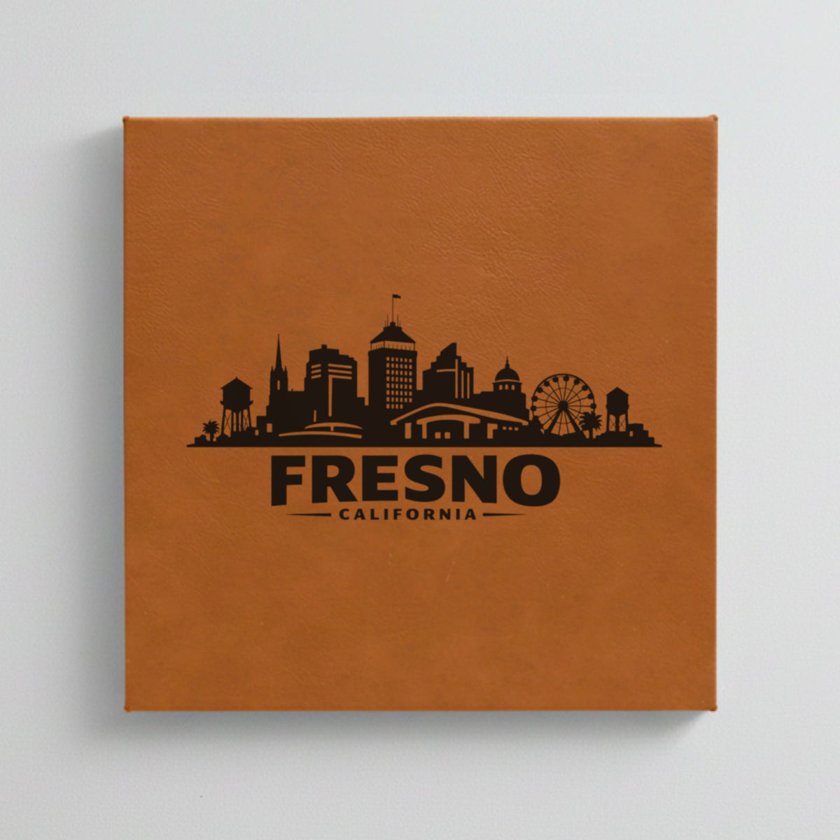 Close up of the Fresno, California skyline engraved on Brown leatherette