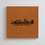 Close up of the Garland, Texas skyline engraved on Brown leatherette