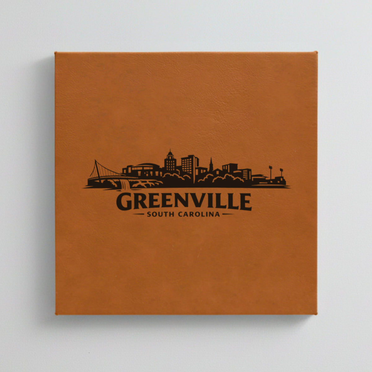 Close up of the Greenville, South Carolina skyline engraved on Brown leatherette