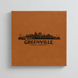 Close up of the Greenville, South Carolina skyline engraved on Brown leatherette