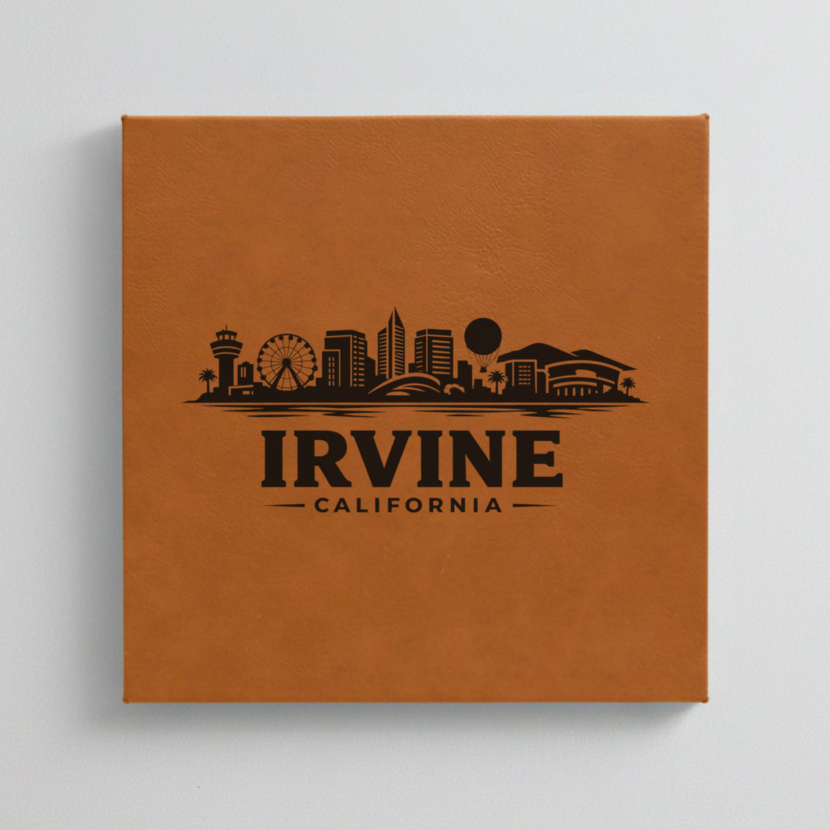 Close up of the Irvine, California skyline engraved on Brown leatherette