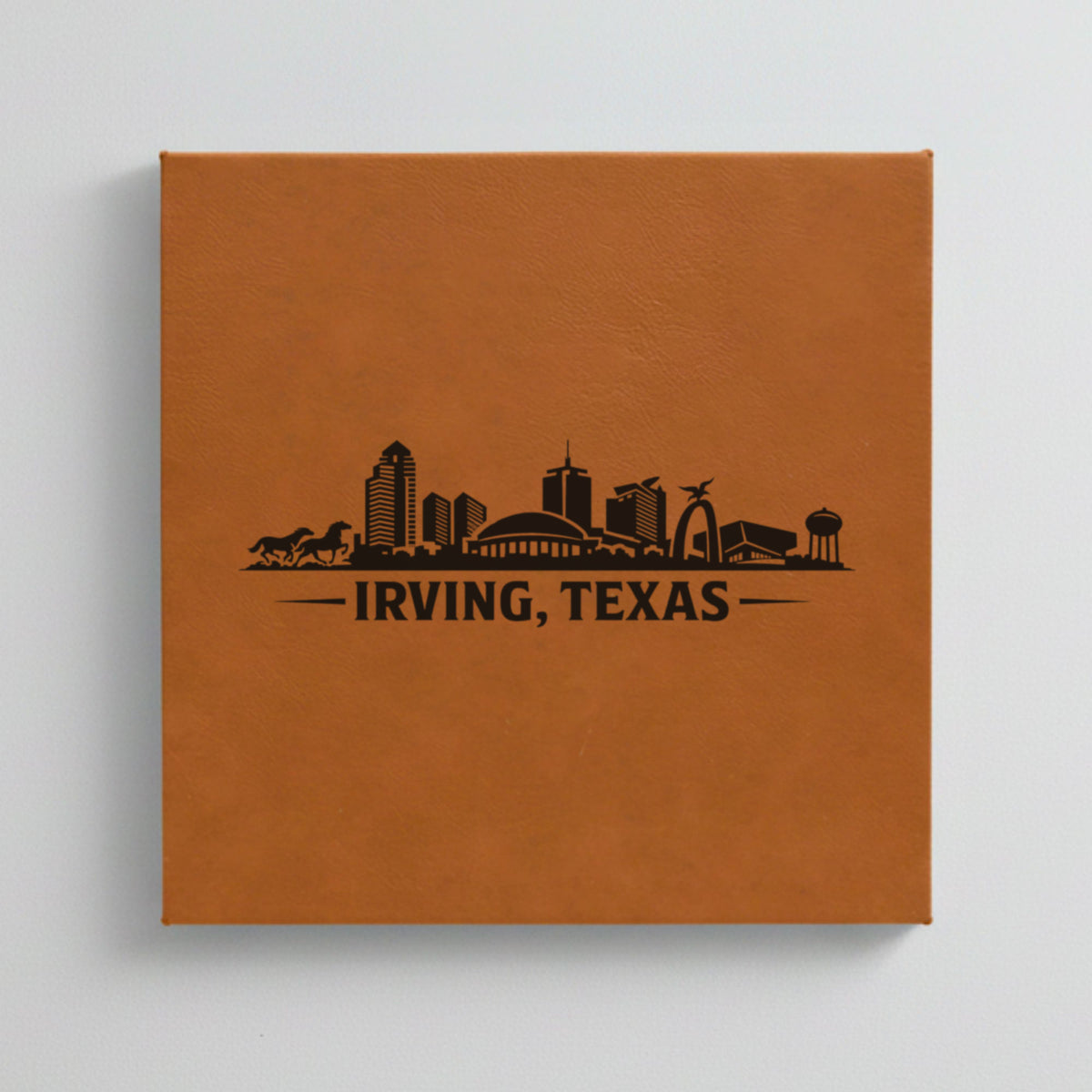 Close up of the Irving, Texas skyline engraved on Brown leatherette