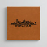 Close up of the Irving, Texas skyline engraved on Brown leatherette