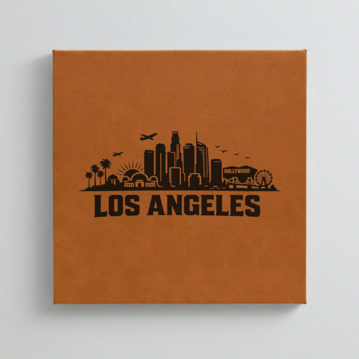 Close up of the Los Angeles, California skyline engraved on Brown leatherette