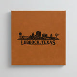 Close up of the Lubbock, Texas skyline engraved on Brown leatherette