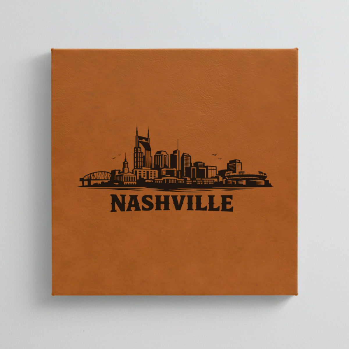 Close up of the Nashville, Tennessee skyline engraved on Brown leatherette
