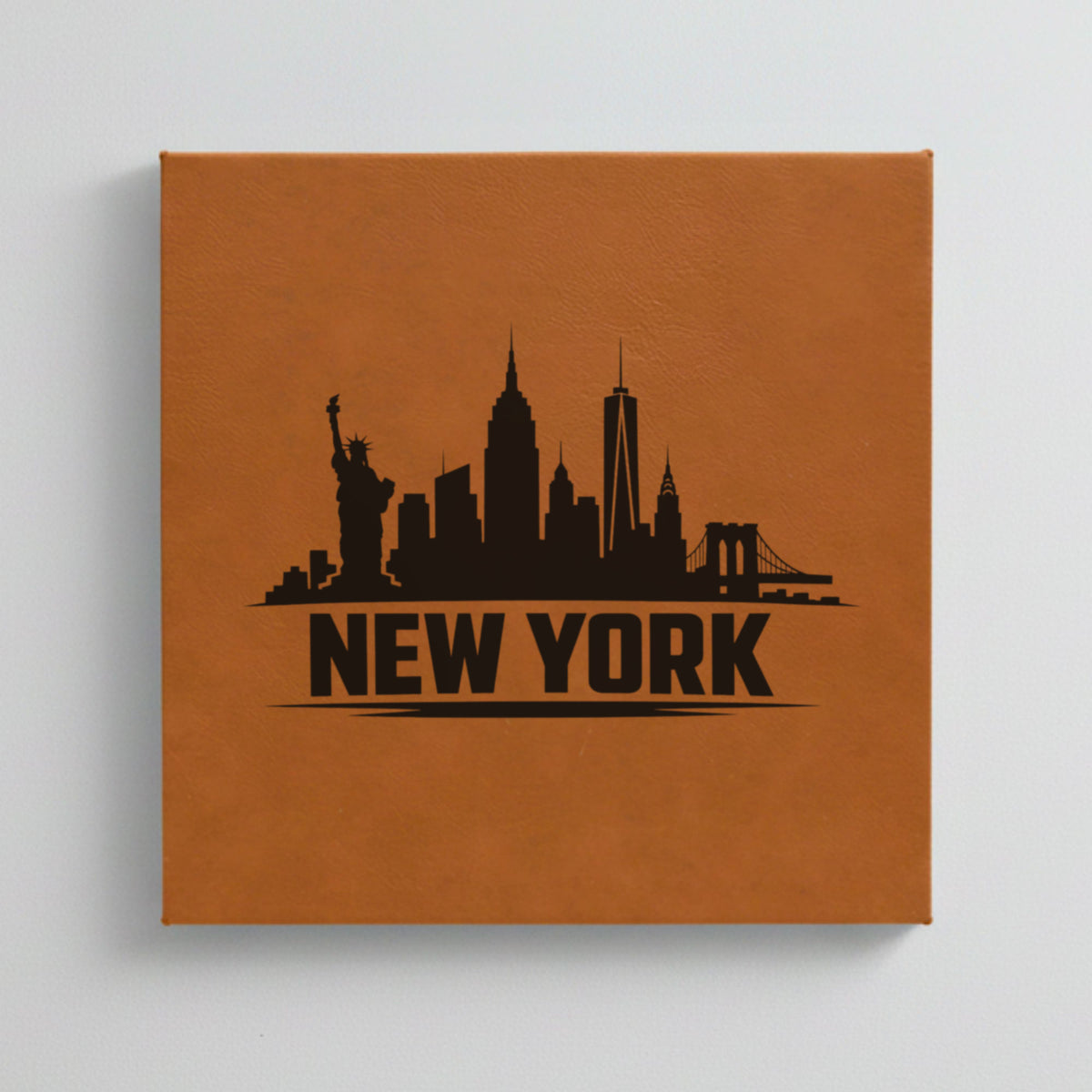 Close up of the New York, New York skyline engraved on Brown leatherette