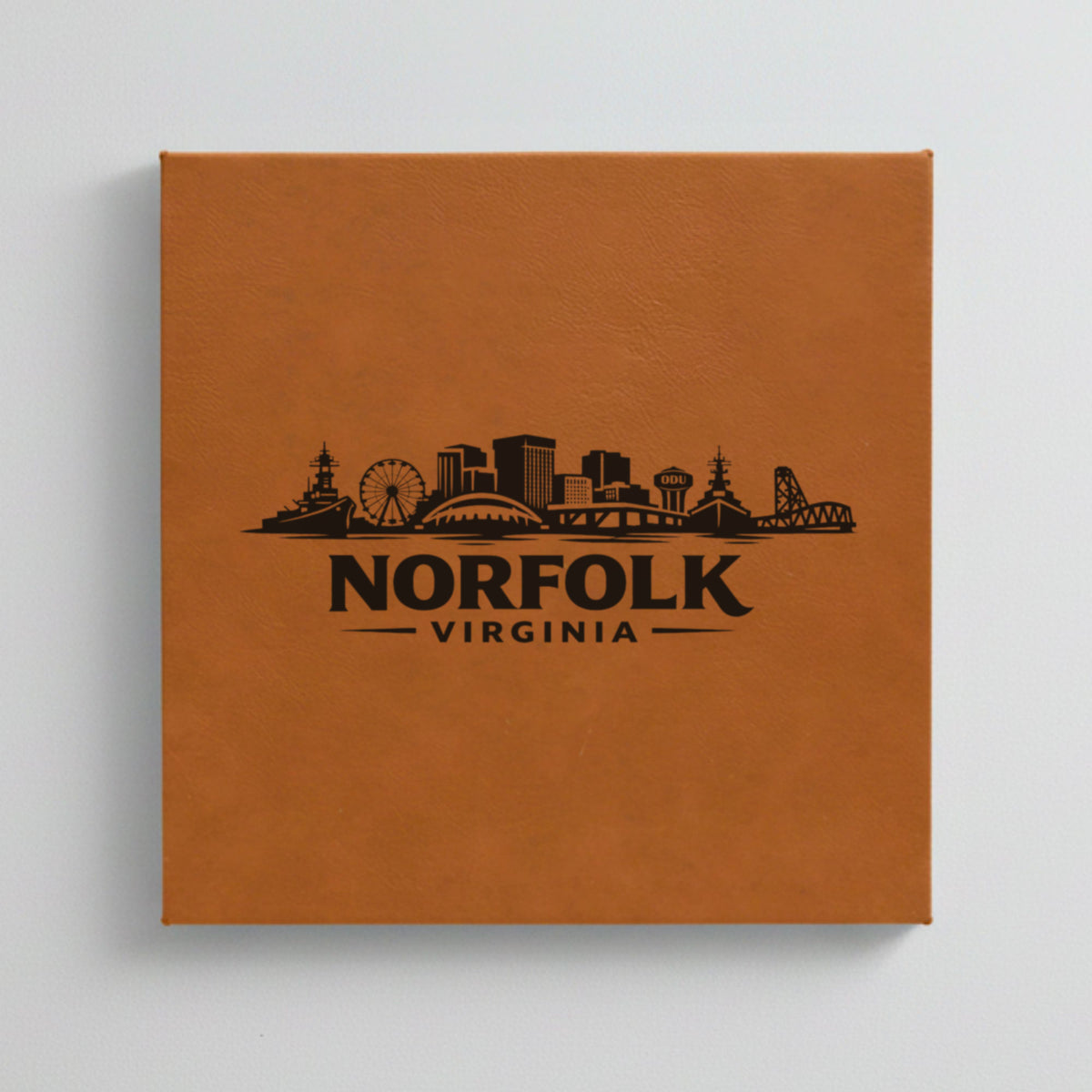 Close up of the Norfolk, Virginia skyline engraved on Brown leatherette