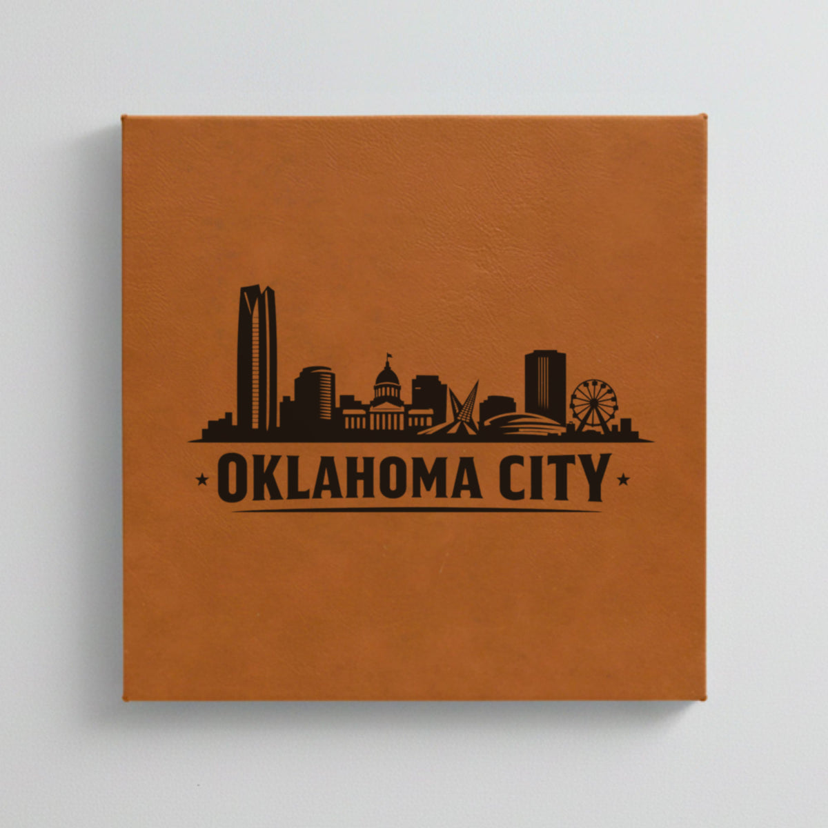 Close up of the Oklahoma City, Oklahoma skyline engraved on Brown leatherette