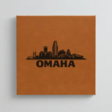 Close up of the Omaha, Nebraska skyline engraved on Brown leatherette