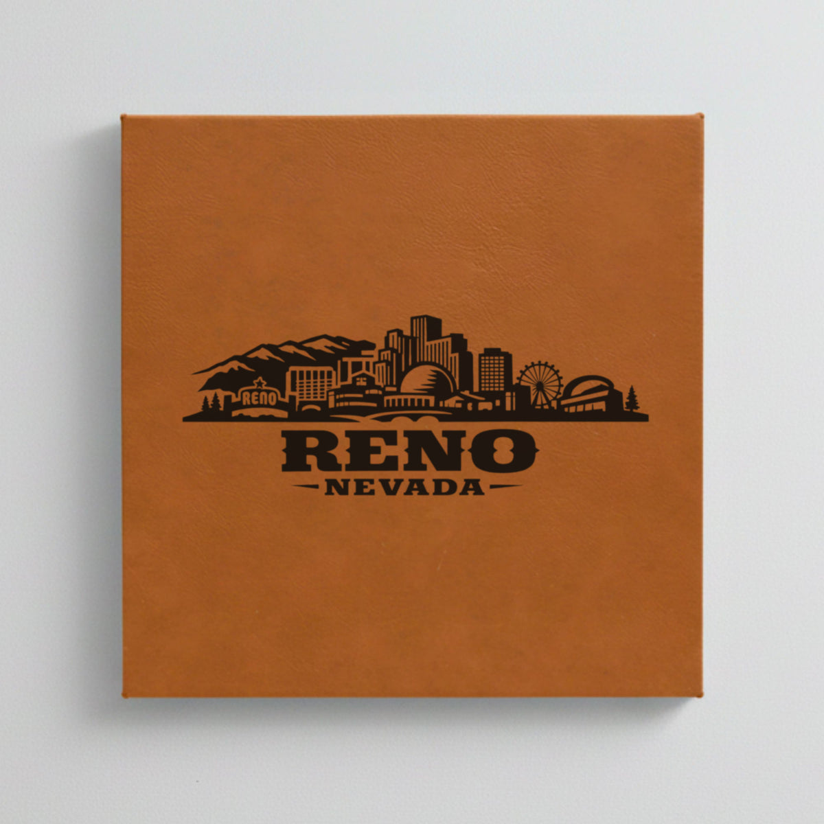 Close up of the Reno, Nevada skyline engraved on Brown leatherette