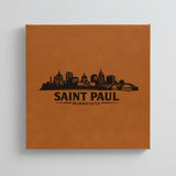 Close up of the Saint Paul, Minnesota skyline engraved on Brown leatherette