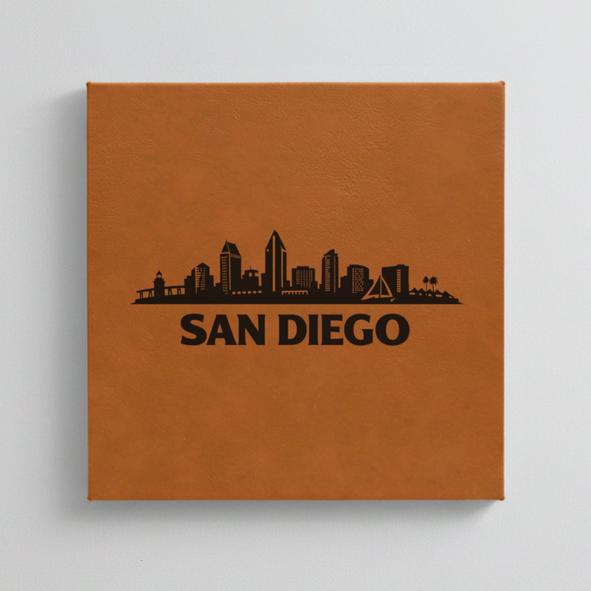 Close up of the San Diego, California skyline engraved on Brown leatherette