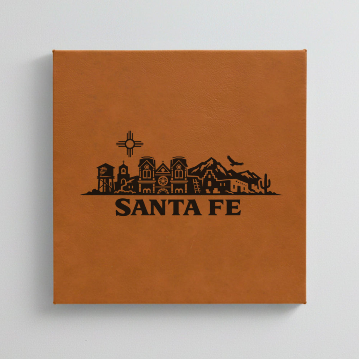 Close up of the Santa Fe, New Mexico skyline engraved on Brown leatherette