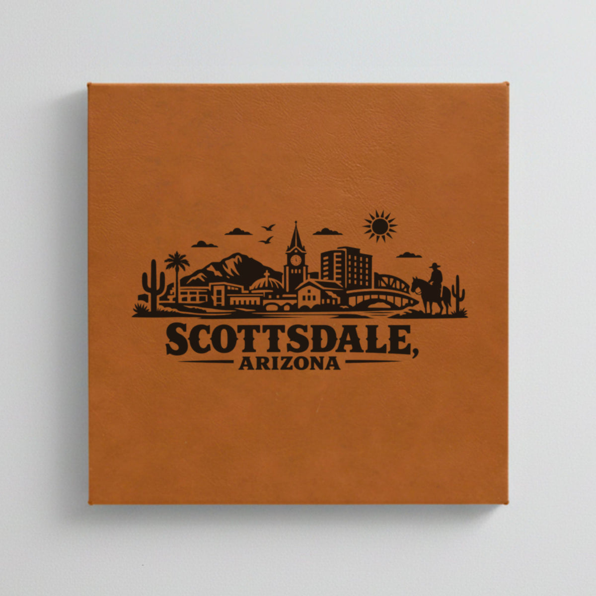 Close up of the Scottsdale, Arizona skyline engraved on Brown leatherette