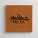 Close up of the Seattle, Washington skyline engraved on Brown leatherette