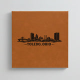 Close up of the Toledo, Ohio skyline engraved on Brown leatherette