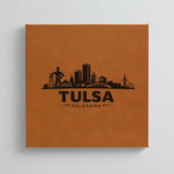 Close up of the Tulsa, Oklahoma skyline engraved on Brown leatherette