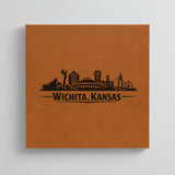 Close up of the Wichita, Kansas skyline engraved on Brown leatherette