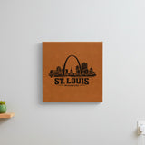 Brown leatherette wall sign engraved with the St. Louis, Missouri skyline, hanging on a wall