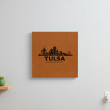 Brown leatherette wall sign engraved with the Tulsa, Oklahoma skyline, hanging on a wall
