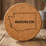 Washington round cork coaster engraved with the state outline and WASHINGTON in hand-drawn brush lettering