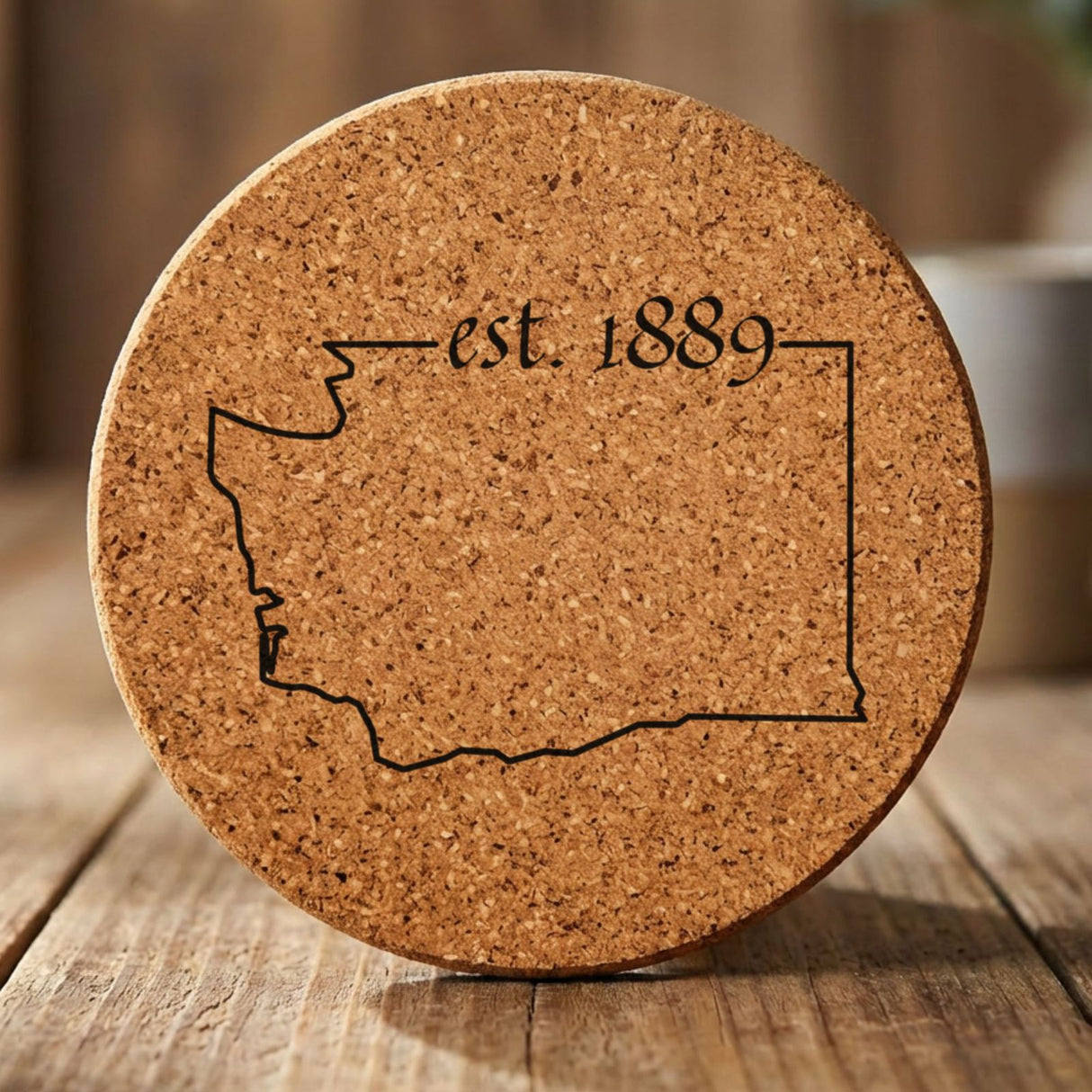 Washington round cork coaster engraved with the state outline and est. 1889