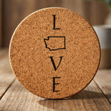 Washington round cork coaster engraved with LOVE stacked vertically using the state as the letter O