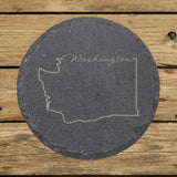 Washington round slate coaster engraved with the state outline and Washington in script lettering