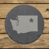 Washington round slate coaster engraved with the state shape and a star