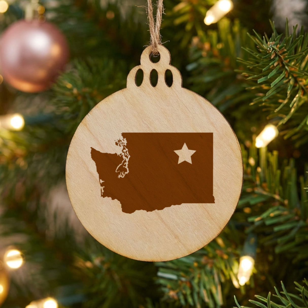 Washington round wood Christmas ornament engraved with the state shape and a star