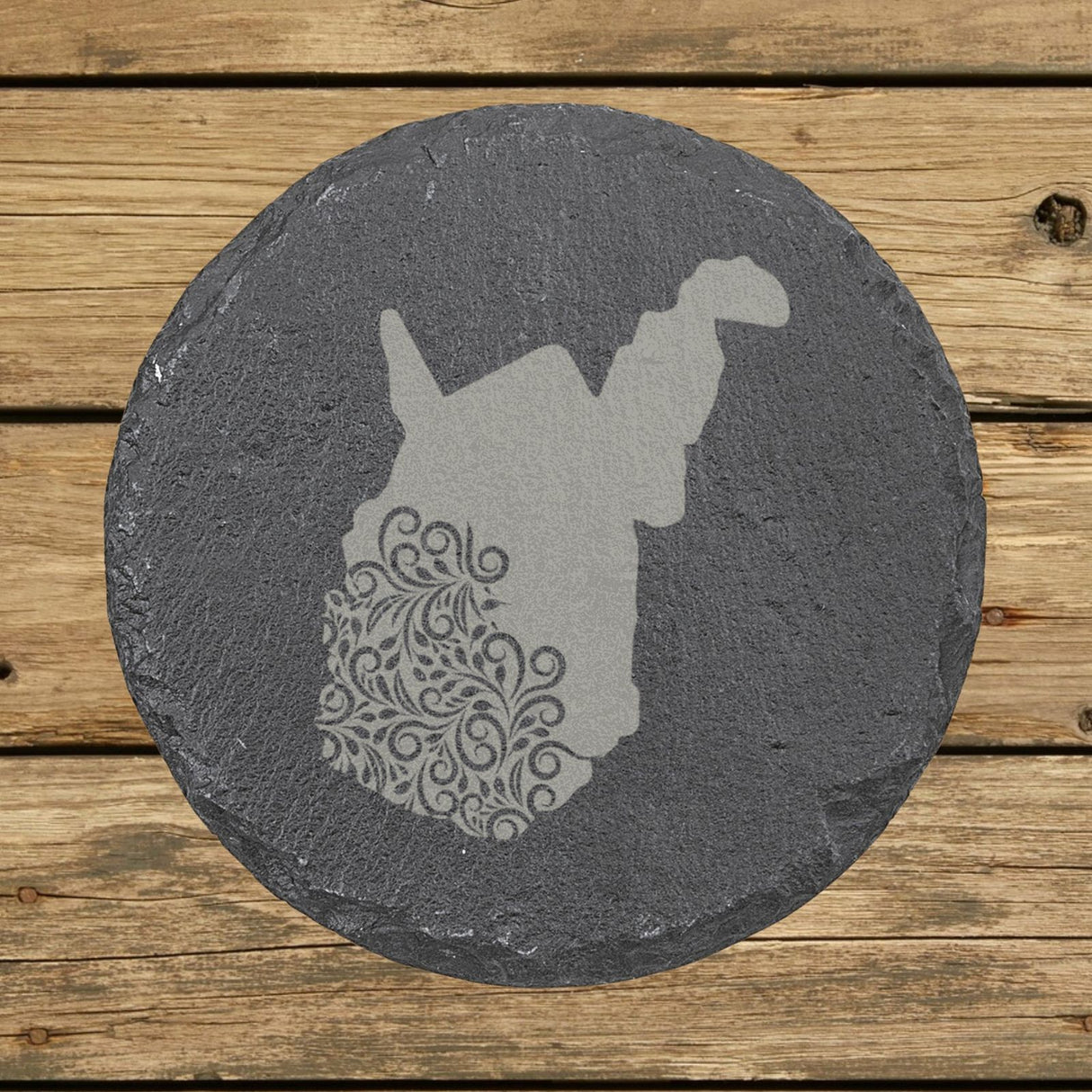 West Virginia round slate coaster engraved with the state shape in ornate floral scrollwork