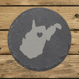 West Virginia round slate coaster engraved with the state shape and a heart