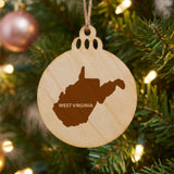 West Virginia round wood Christmas ornament engraved with the state shape and WEST VIRGINIA in bold lettering