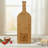 Bamboo wine bottle shaped cutting board laser engraved with "Crazy Cat Lady"