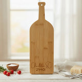 Bamboo wine bottle cutting board laser engraved with a custom zip code design