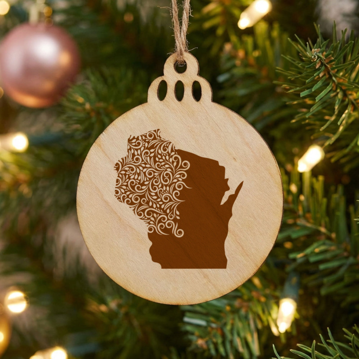 Wisconsin round wood Christmas ornament engraved with the state shape in ornate floral scrollwork