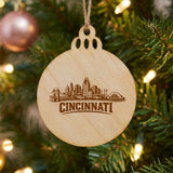 Cincinnati, Ohio skyline engraved on a round wood Christmas ornament