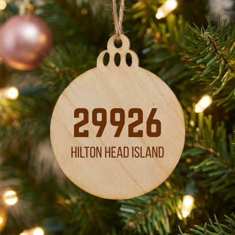 Wood Christmas ornament laser engraved with a custom zip code design
