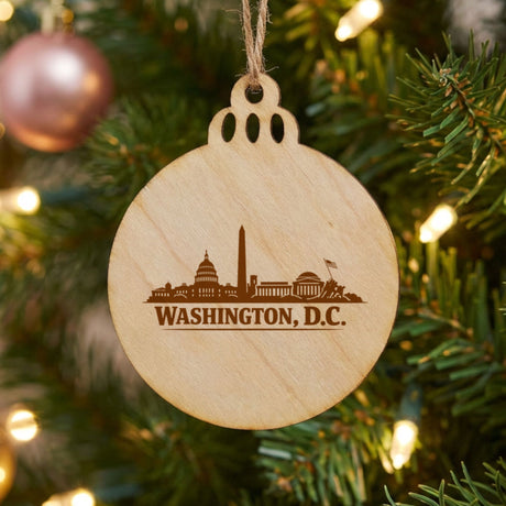 Washington, DC skyline engraved on a round wood Christmas ornament