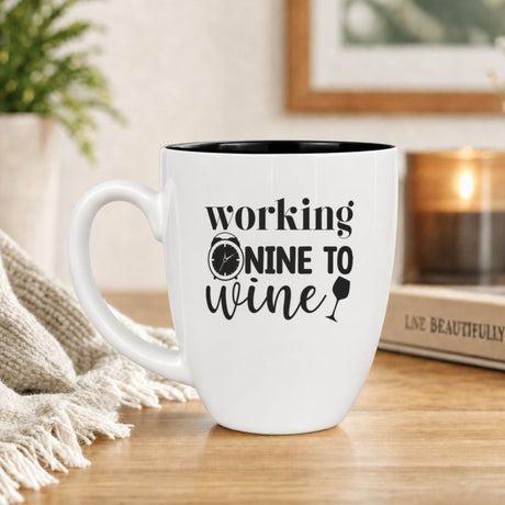 16 oz white ceramic coffee mug with "Working Nine to Wine"