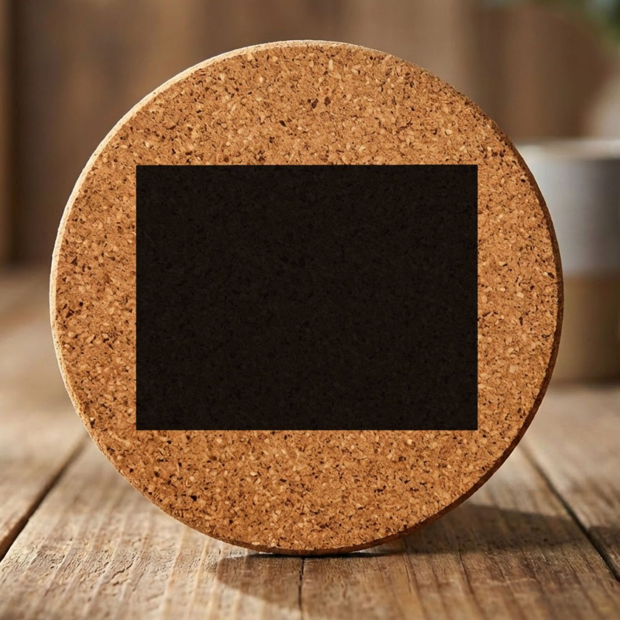 Wyoming round cork coaster with the full state shape engraved