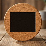 Wyoming round cork coaster with the full state shape engraved