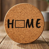 Wyoming round cork coaster engraved with HOME using the state outline as the letter O