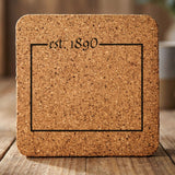 Wyoming square cork coaster engraved with the state outline and est. 1890