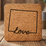 Wyoming square cork coaster engraved with a hand-drawn state outline and love in cursive