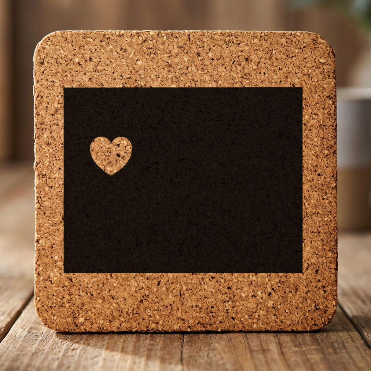 Wyoming square cork coaster engraved with the state shape and a heart
